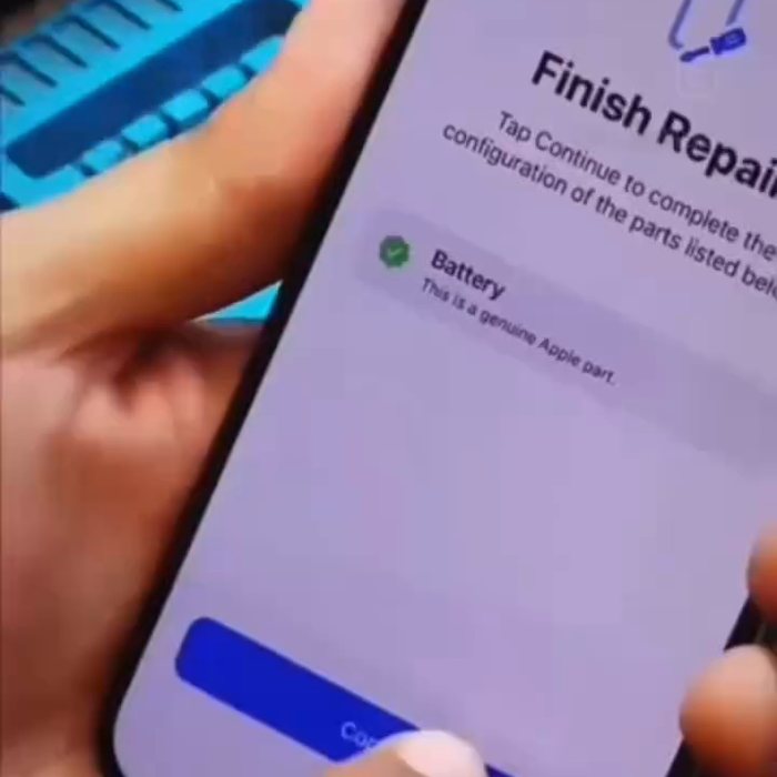An iPhone showing the iOS parts and service screen confirming a genuine battery after repair
